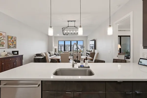 a view of a room with shelves and wooden floor