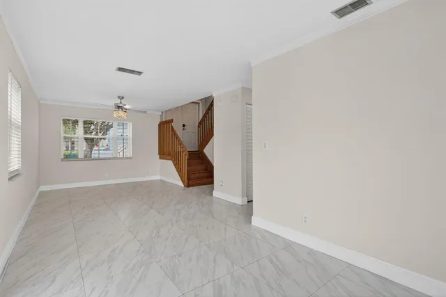 an empty room with windows and closet