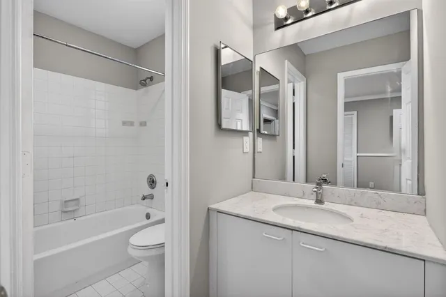 a bathroom with a white bath tub and a shower