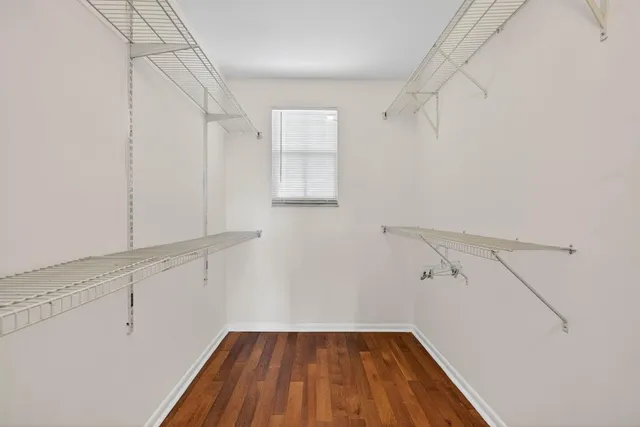 an aerial view of multiple houses with a yard