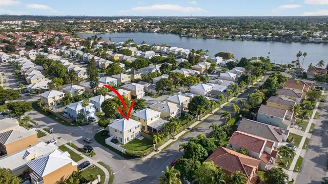 an aerial view of residential houses with outdoor space