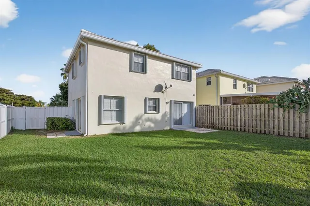 a view of a yard in front of a house with a yard