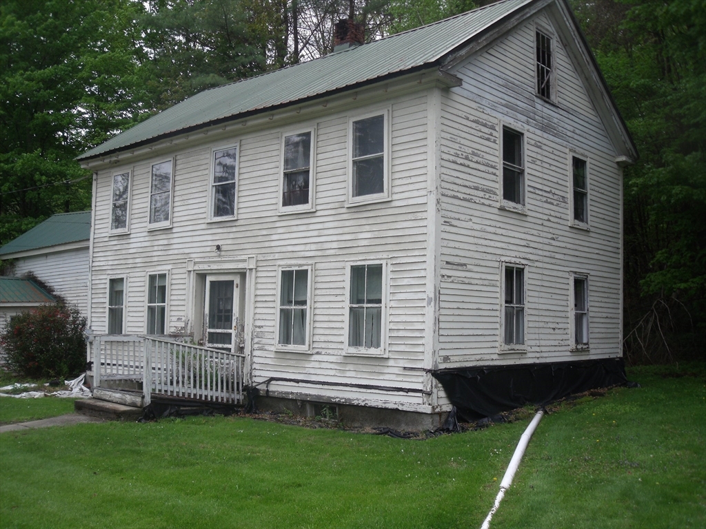 35 Goshen Road Williamsburg, MA 01096 - Photo 1 of 21 a front view of a house with a garden