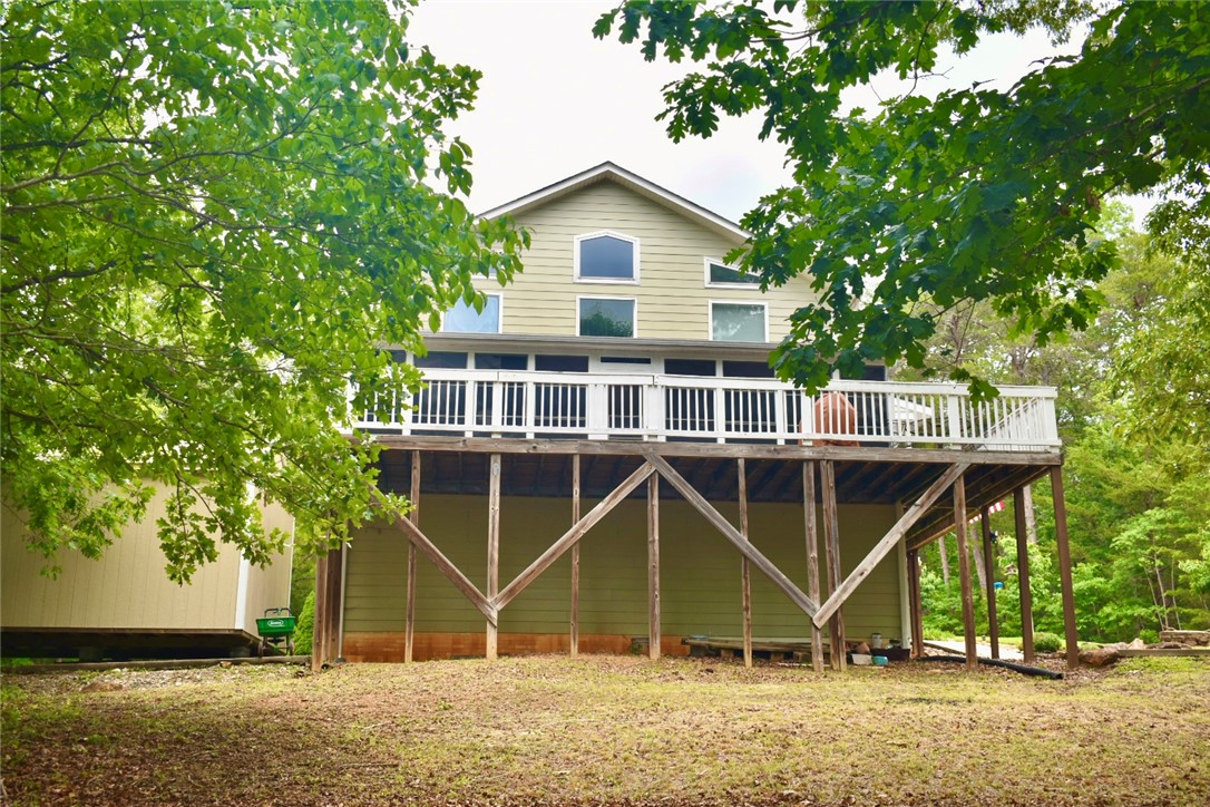 608 McKinney Way Westminster, SC 29693 - Photo 24 of 34 A spacious elevated deck extends across the rear of this inviting home, framed by mature trees.