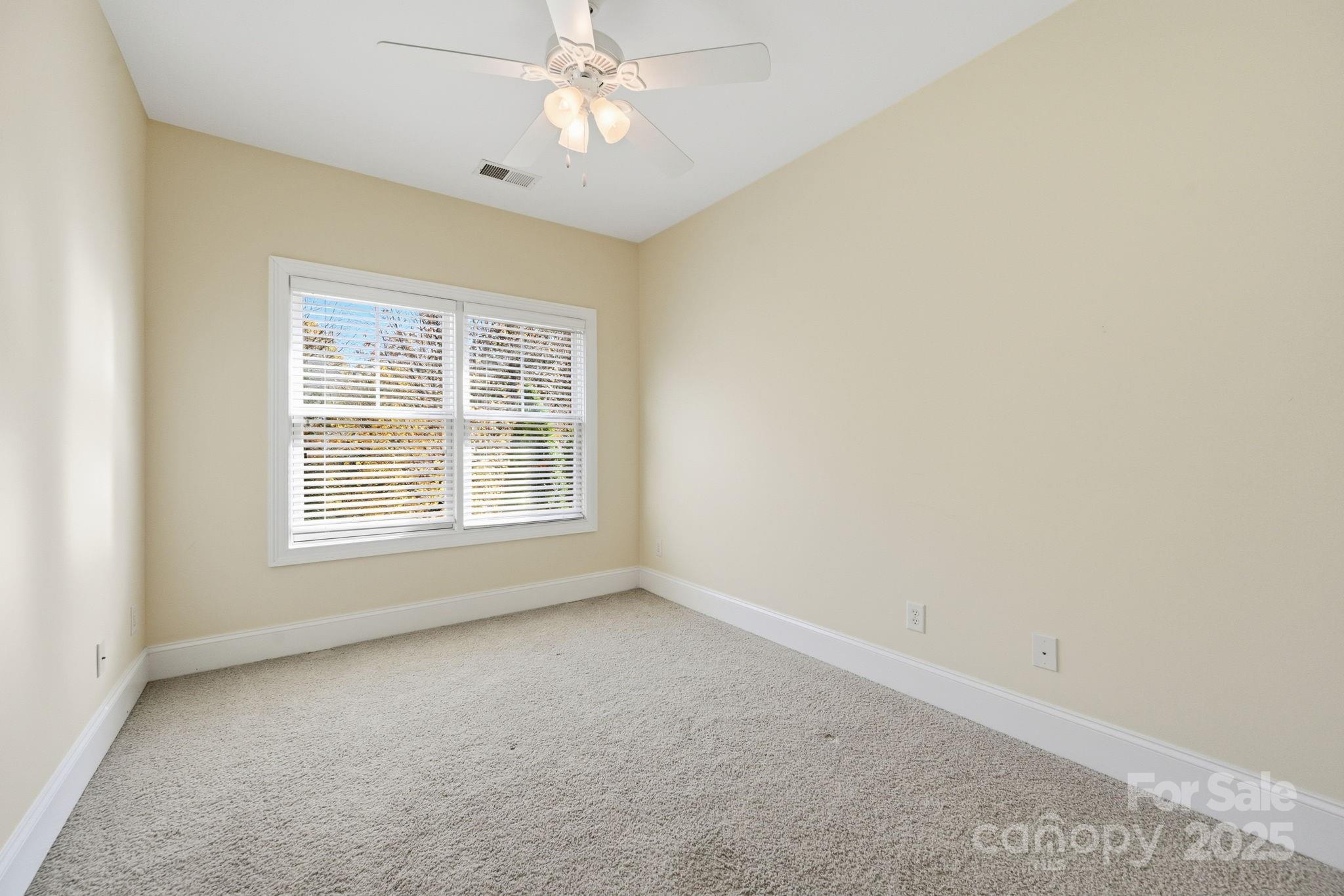 329 Spring Street Davidson, NC 28036 - Photo 18 of 31 an empty room with a window