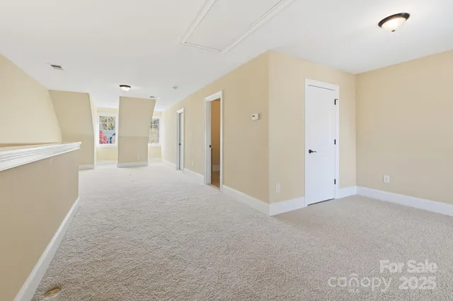 a view of an empty room with stairs