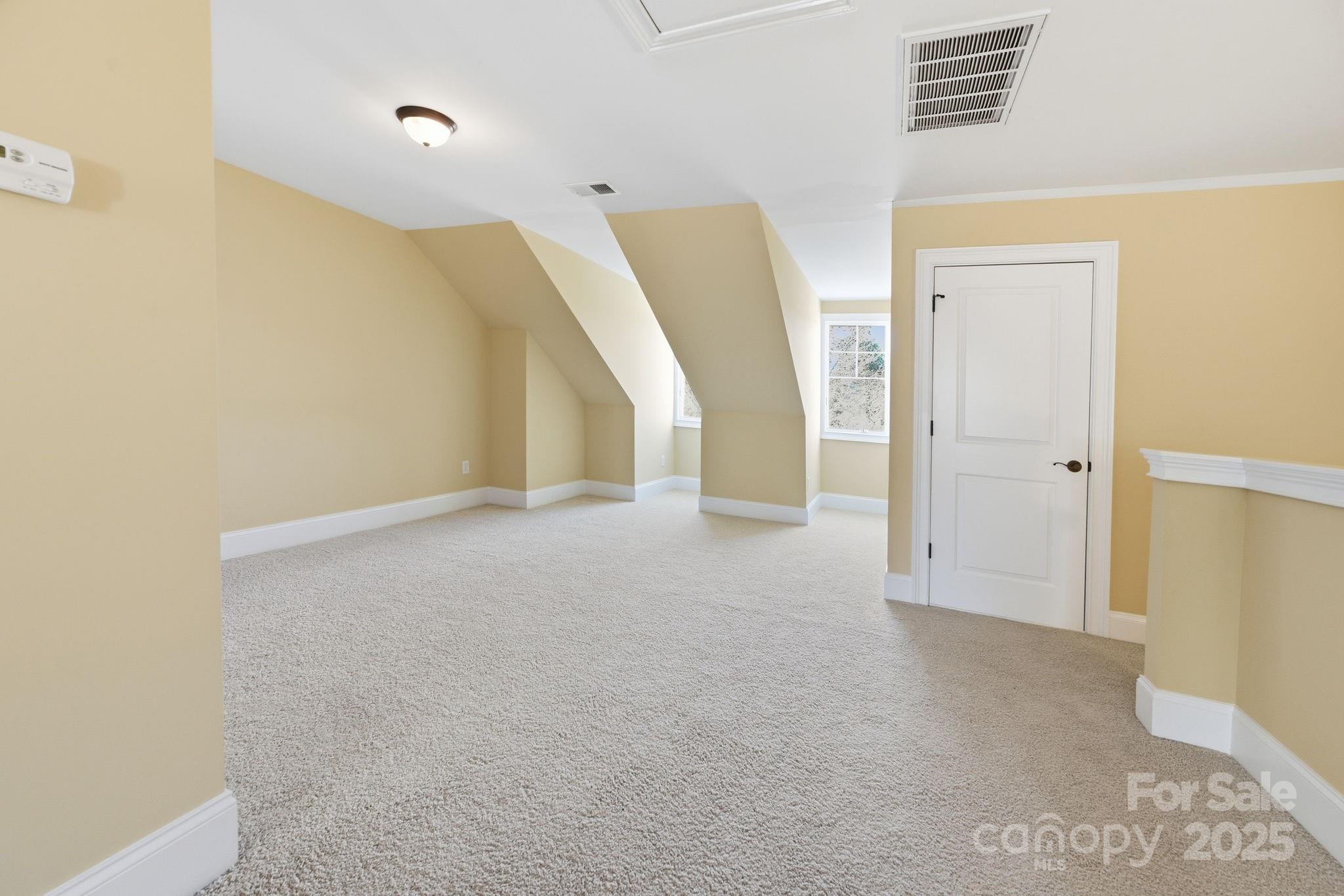 329 Spring Street Davidson, NC 28036 - Photo 25 of 31 a view of an empty room with stairs