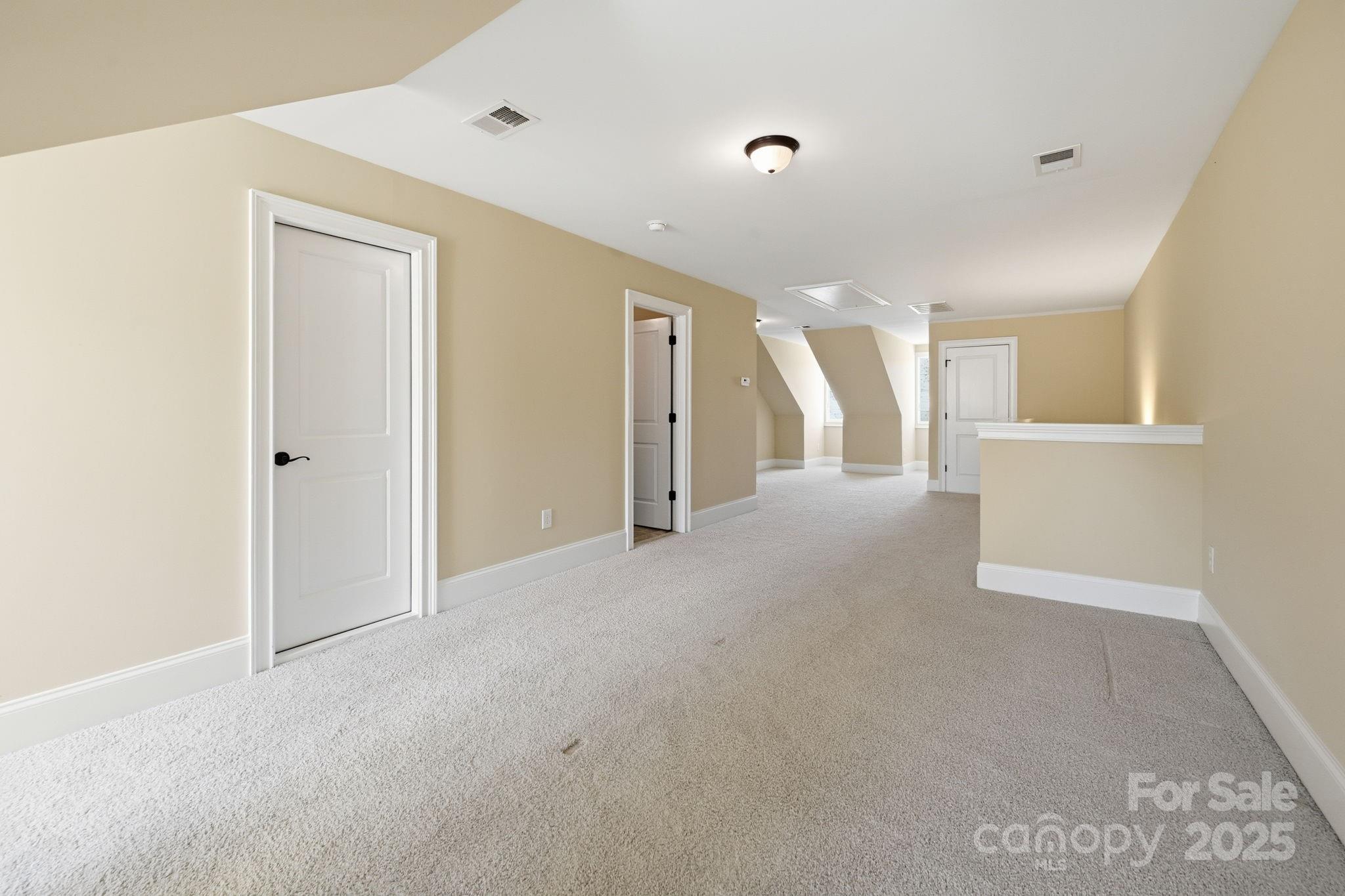 329 Spring Street Davidson, NC 28036 - Photo 26 of 31 a view of a big room with closet and windows