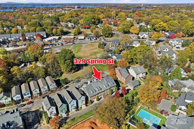 an aerial view of residential houses with outdoor space