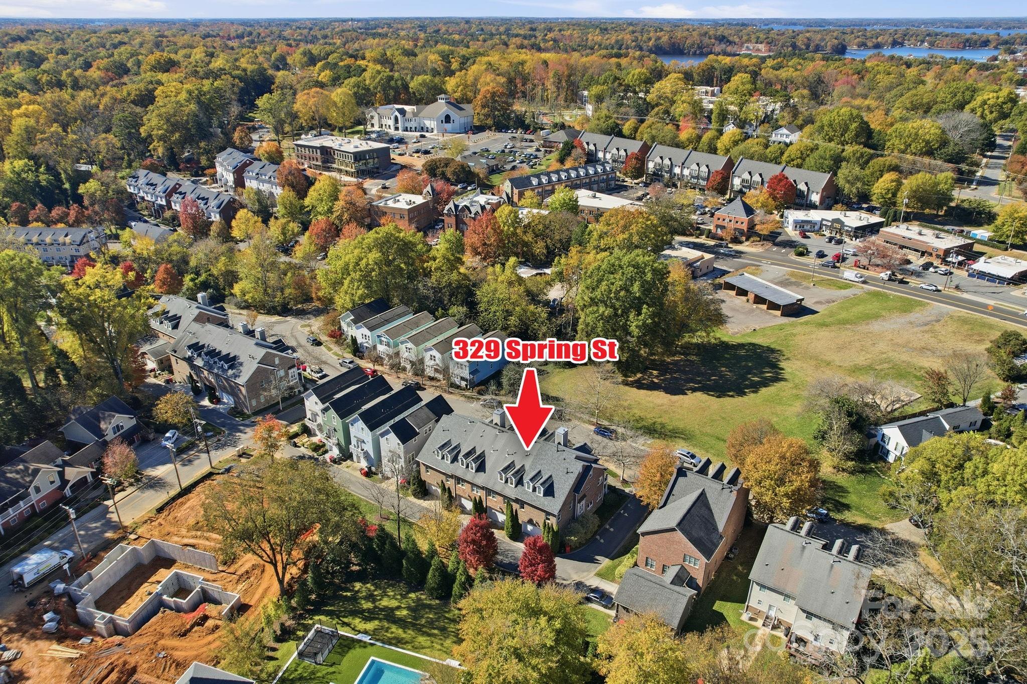 329 Spring Street Davidson, NC 28036 - Photo 30 of 31 an aerial view of residential houses with outdoor space