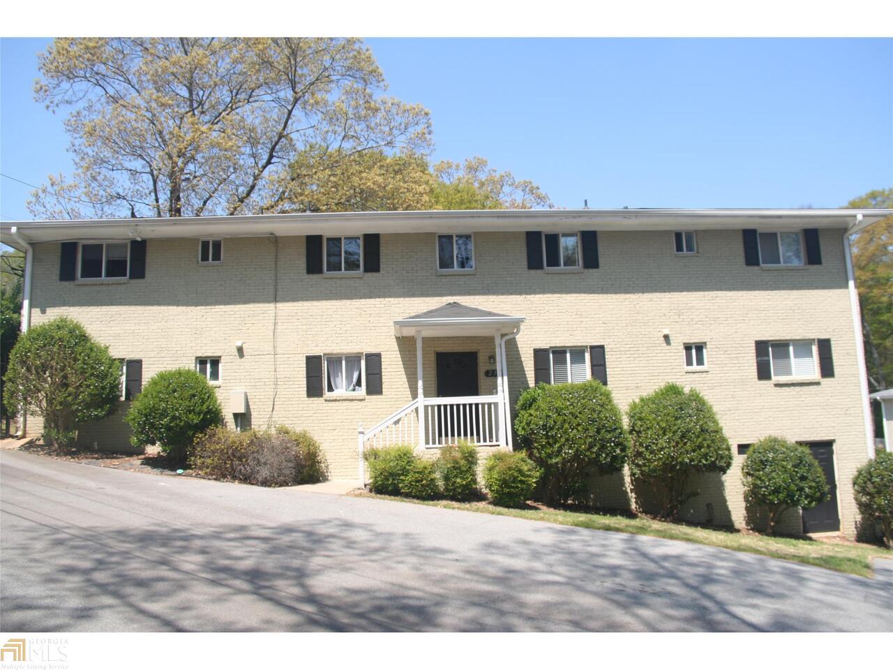 232 Olympic Place, Unit 43 Decatur, GA 30030 - Photo 1 of 1 a front view of a house with a yard