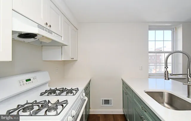 a bedroom with a bed and a stove