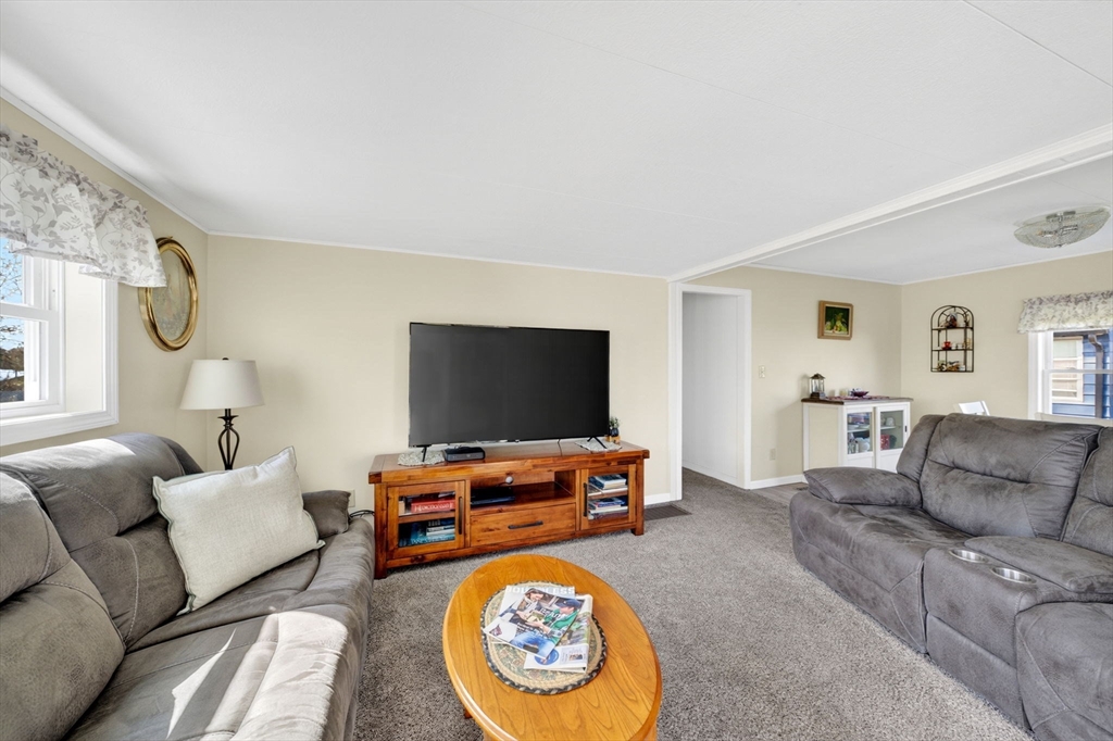19 Timber Lane Wareham, MA 02571 - Photo 13 of 38 a living room with furniture and a flat screen tv