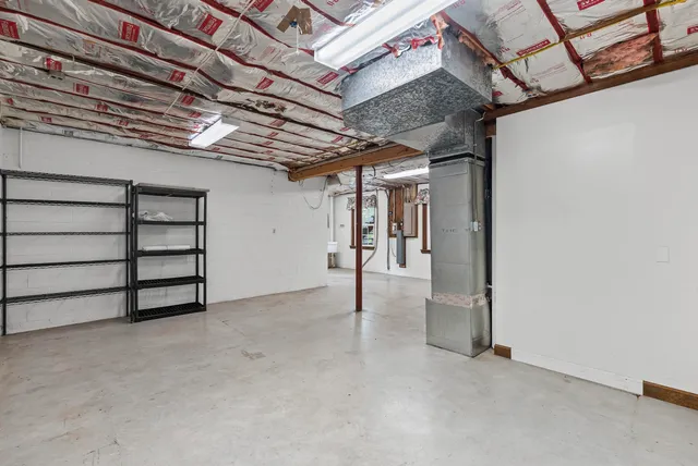 a view of a room with wooden walls