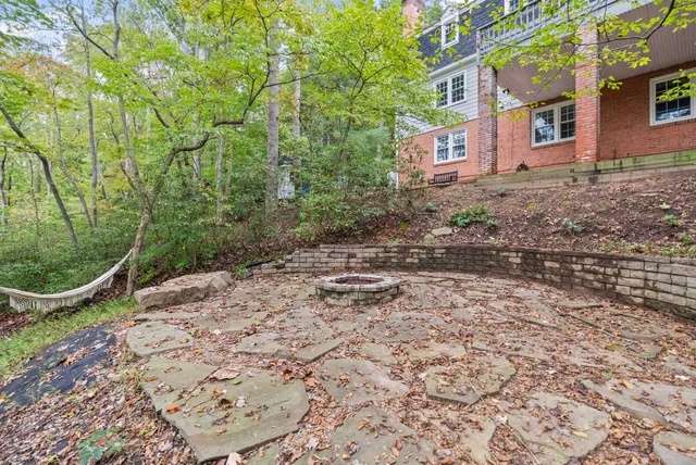 a view of a house with a backyard