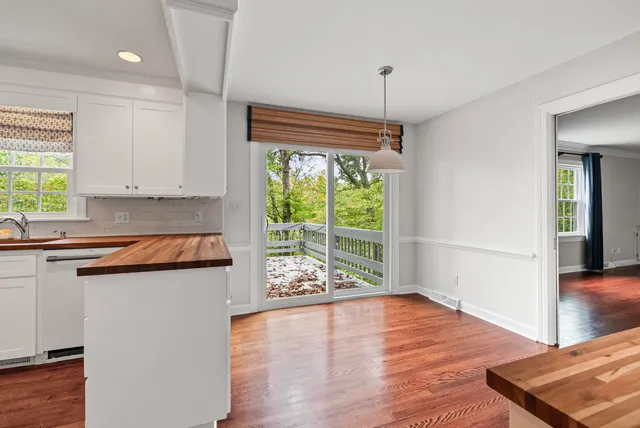a kitchen that has a lot of fruit on it and wooden floor