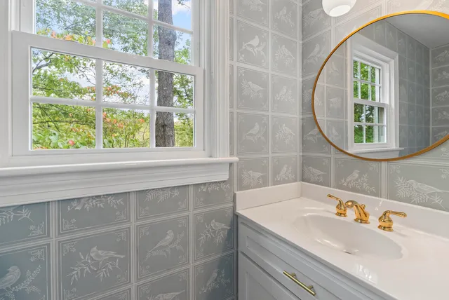 a bathroom with a sink and a mirror