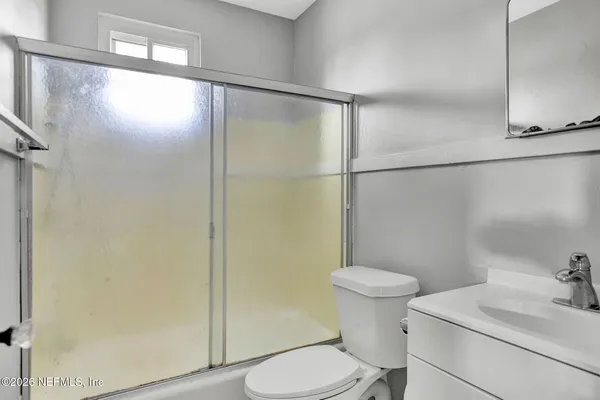 a kitchen with a sink cabinets and stainless steel appliances