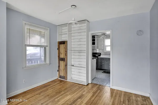 a kitchen with a sink a refrigerator and window
