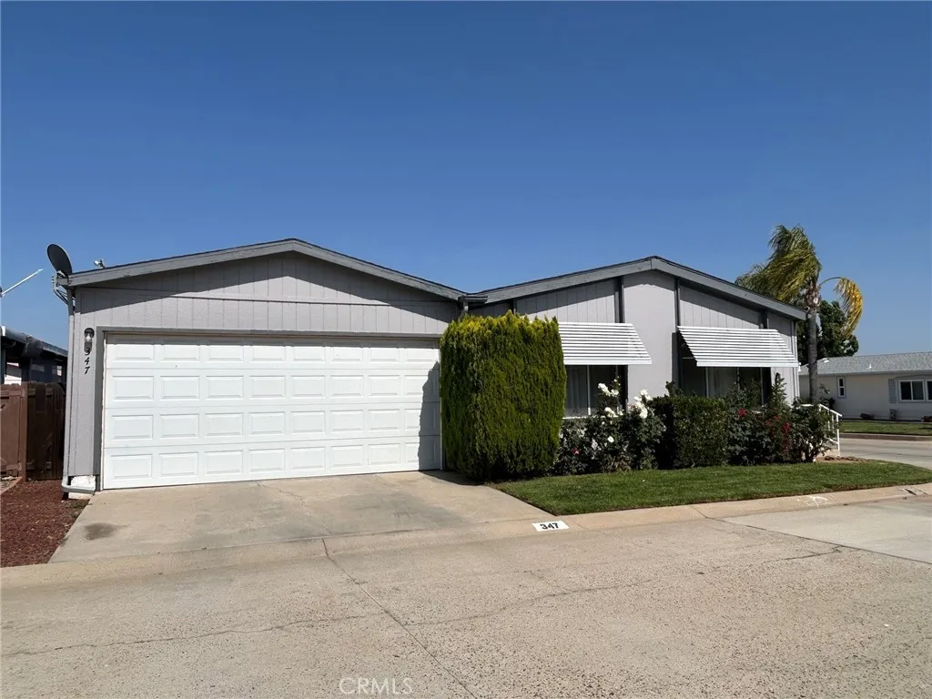27250 Murrieta Road, Unit 347 Menifee, CA 92586 - Photo 5 of 38 a view of a house with a yard