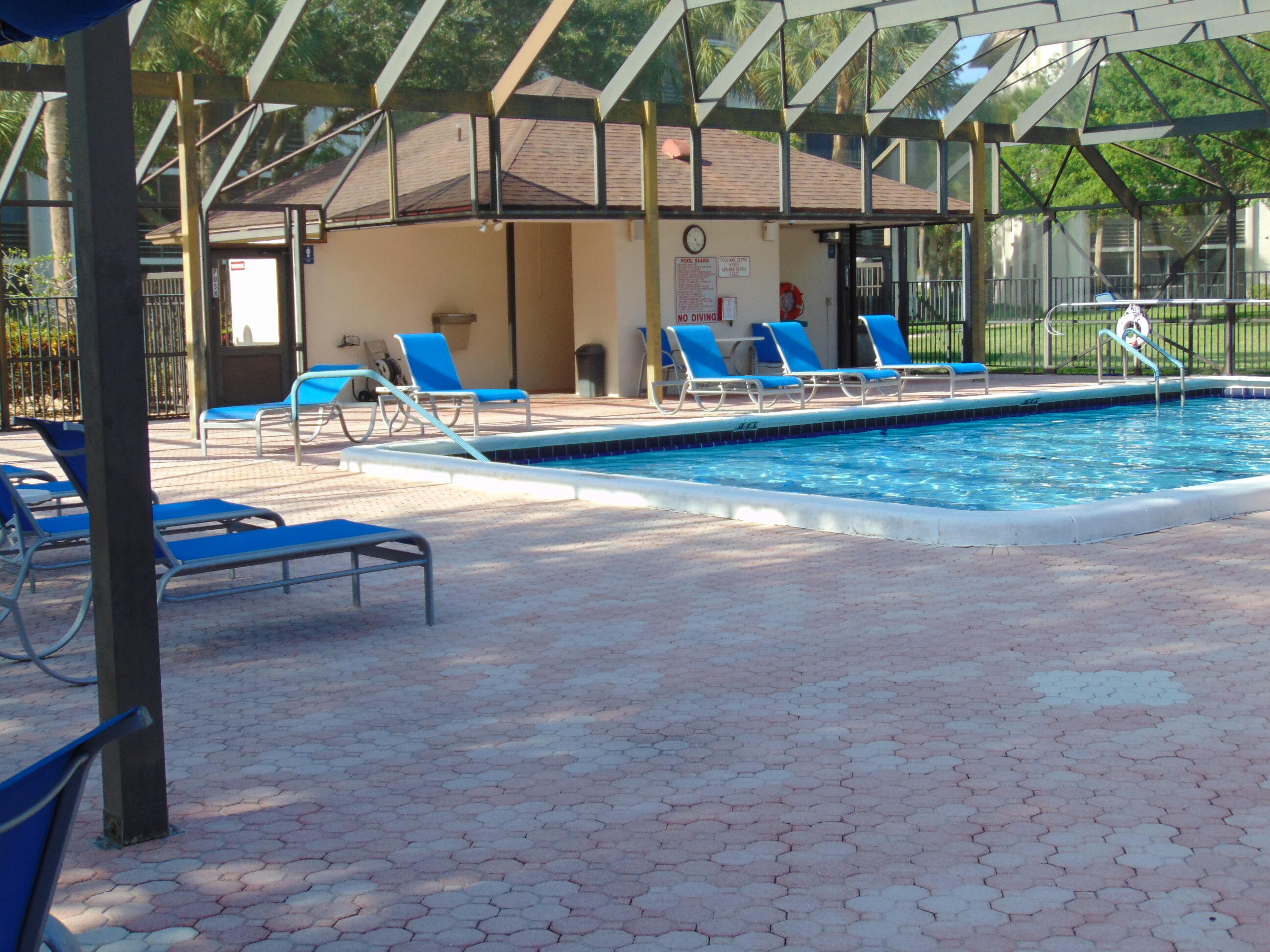 9220 Southwest 14th Street, Unit 3103 Boca Raton, FL 33428 - Photo 49 of 58 a view of a swimming pool with a patio