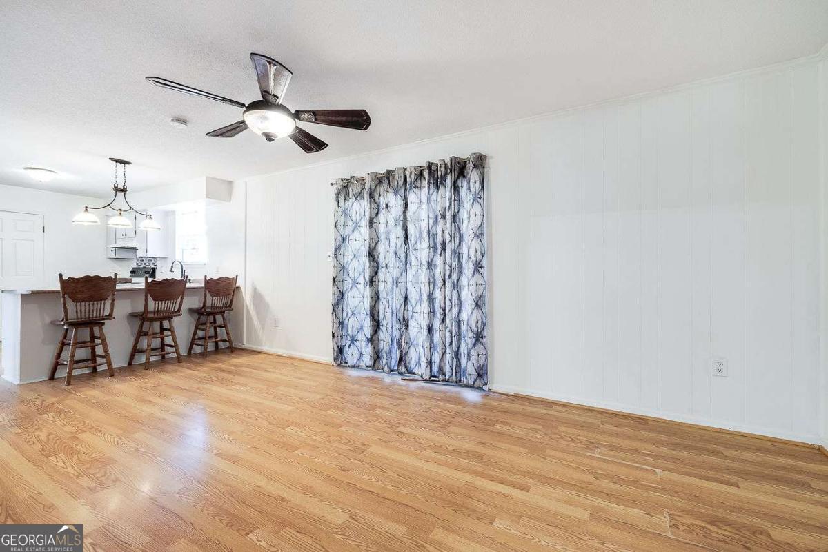 412 Rothwell Street Pooler, GA 31322 - Photo 16 of 32 a view of a room with furniture and a ceiling fan