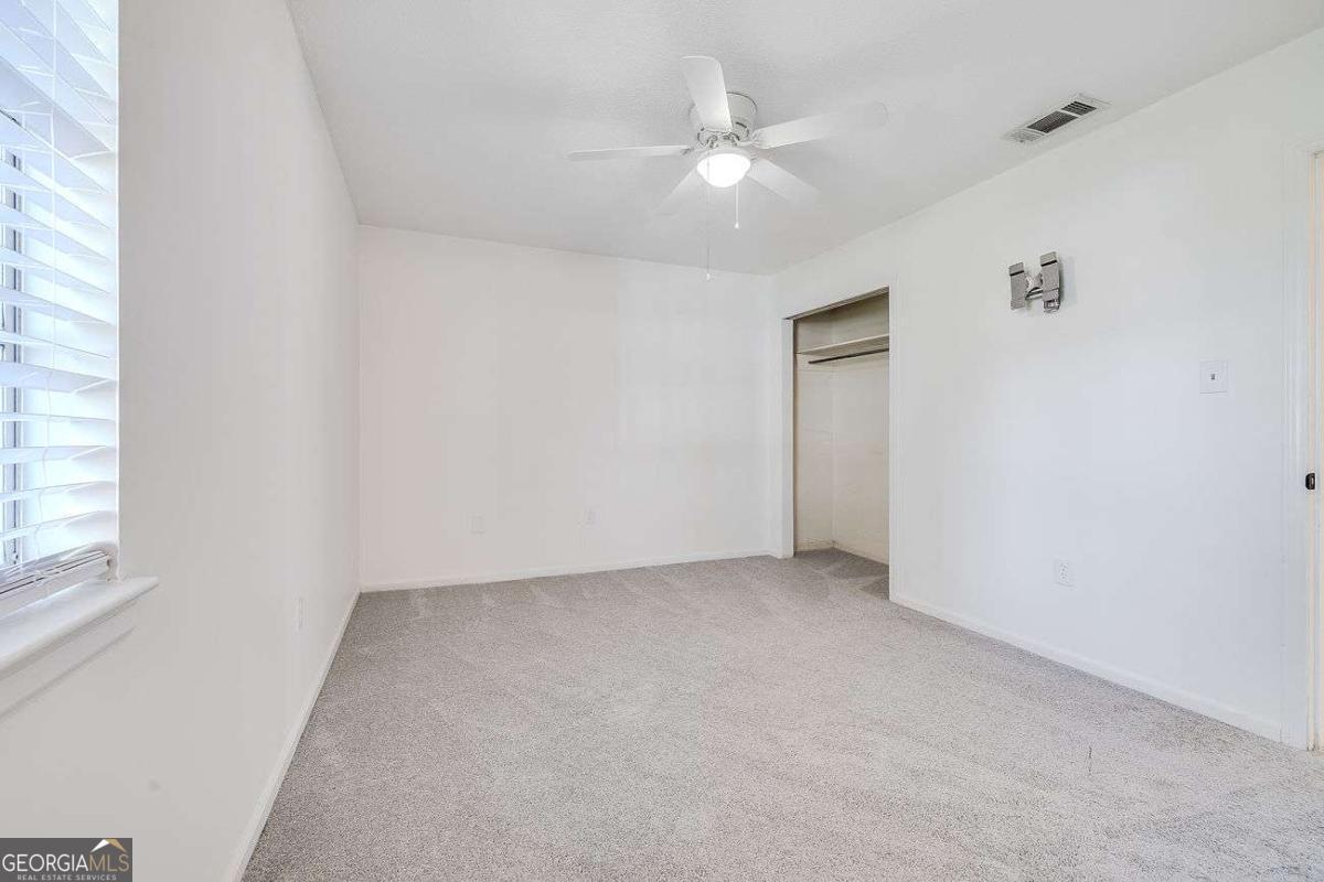 412 Rothwell Street Pooler, GA 31322 - Photo 19 of 32 a view of an empty room with a window