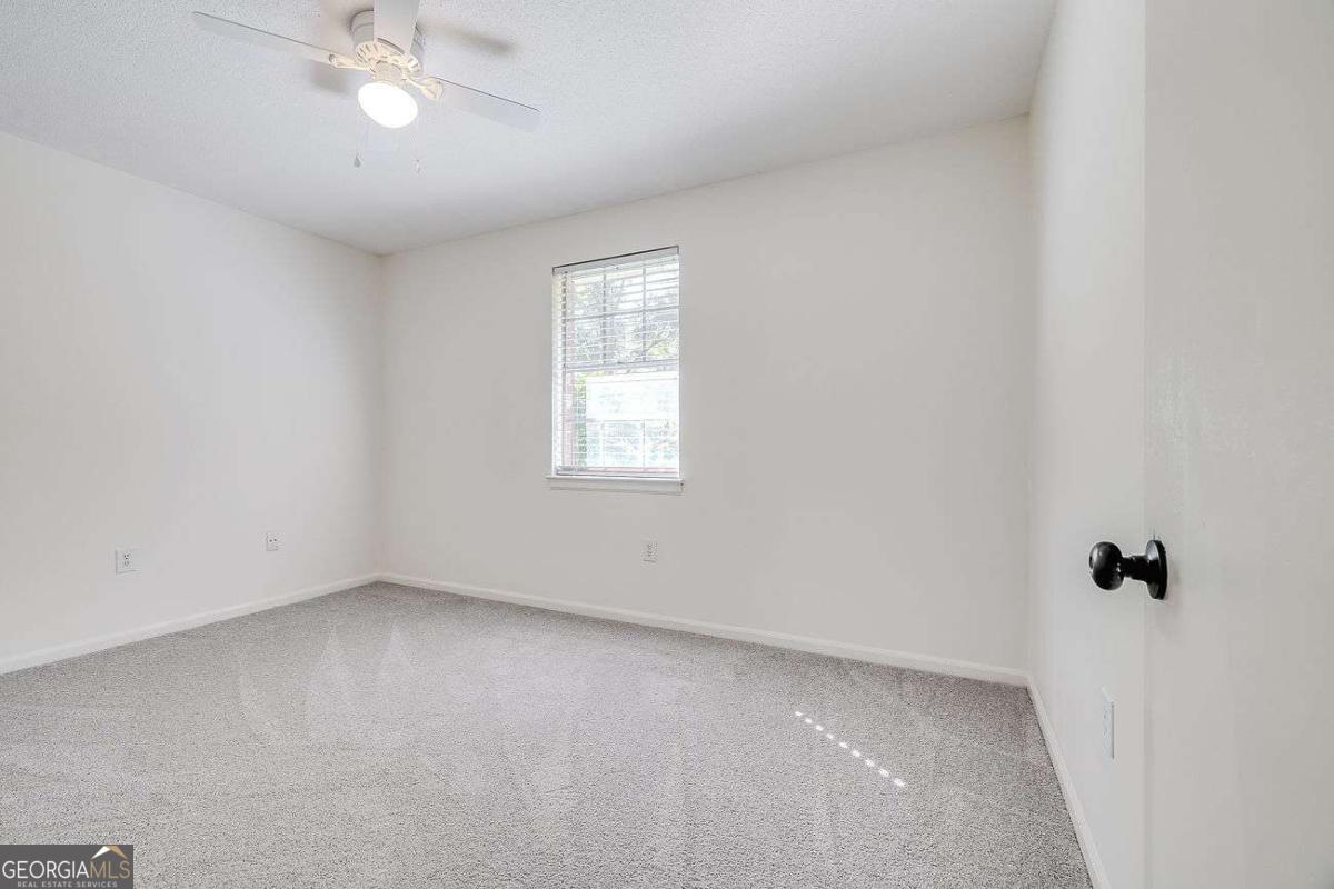 412 Rothwell Street Pooler, GA 31322 - Photo 22 of 32 an empty room with a window