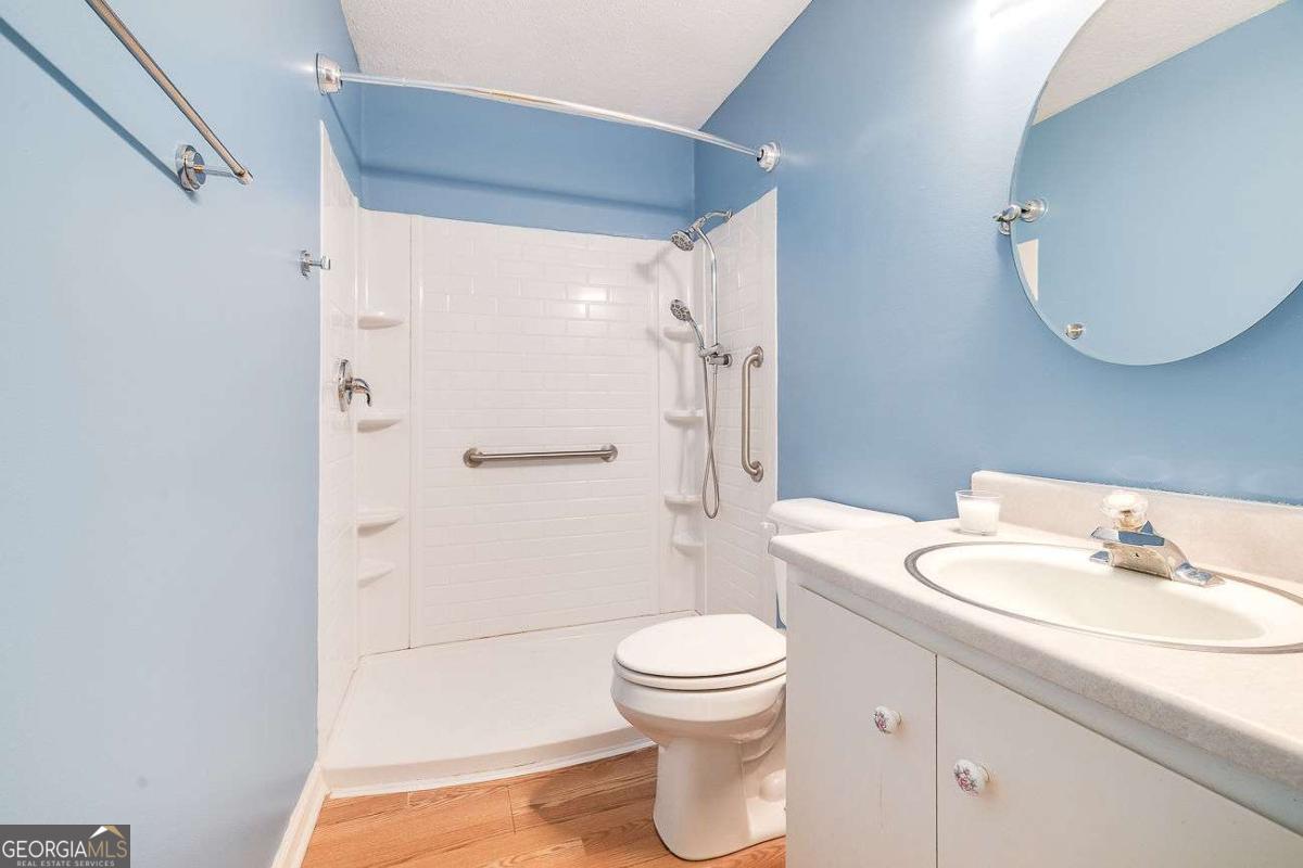 412 Rothwell Street Pooler, GA 31322 - Photo 24 of 32 a bathroom with a sink a toilet and shower