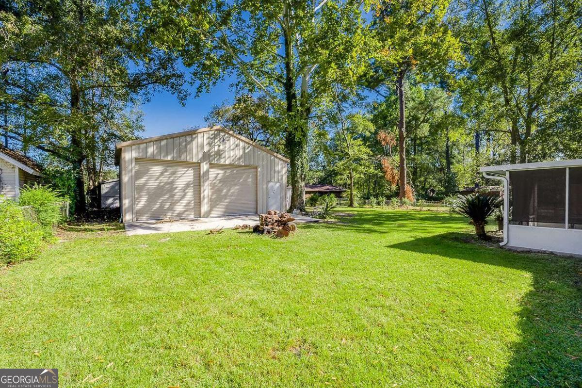 412 Rothwell Street Pooler, GA 31322 - Photo 29 of 32 a view of a park with large trees