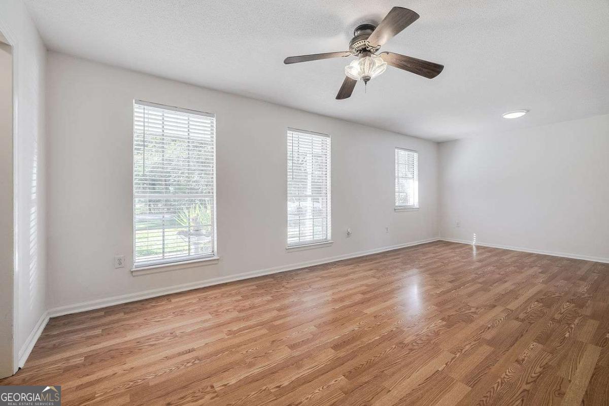 412 Rothwell Street Pooler, GA 31322 - Photo 6 of 32 a view of an empty room with a window