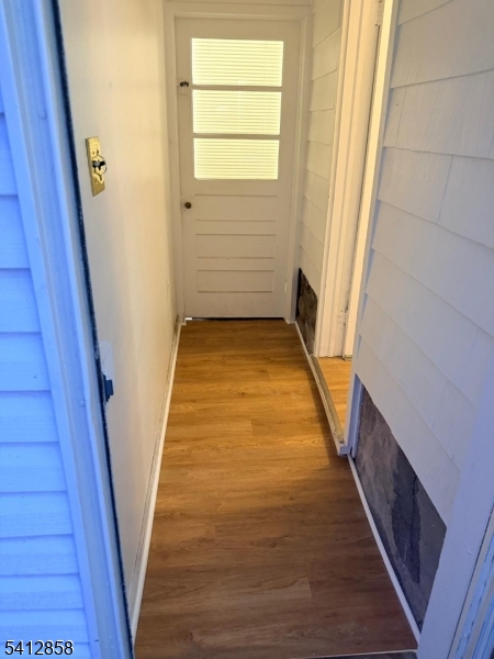 80 Allentown Road Parsippany, NJ 07054 - Photo 4 of 10 a view of a hallway with wooden floor and staircase