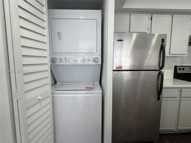 a view of storage and utility room with washer and dryer