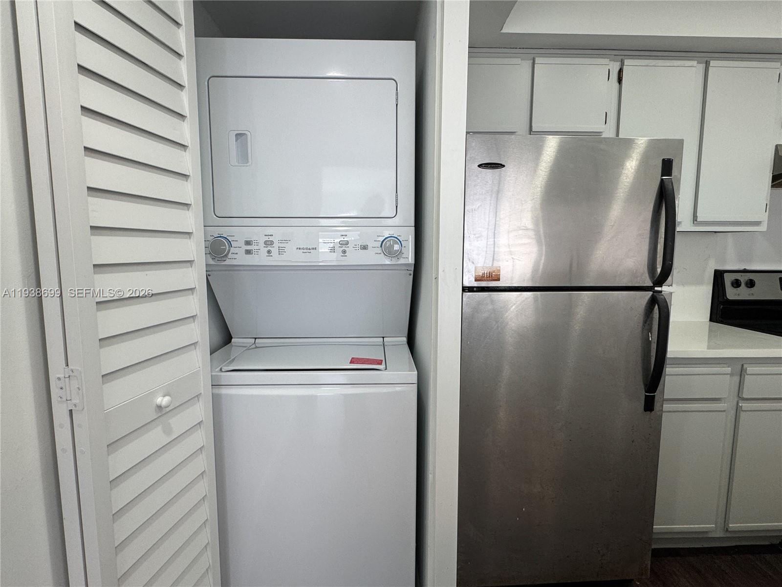5672 Rock Island Road, Unit 271 Tamarac, FL 33319 - Photo 4 of 11 a view of storage and utility room with washer and dryer