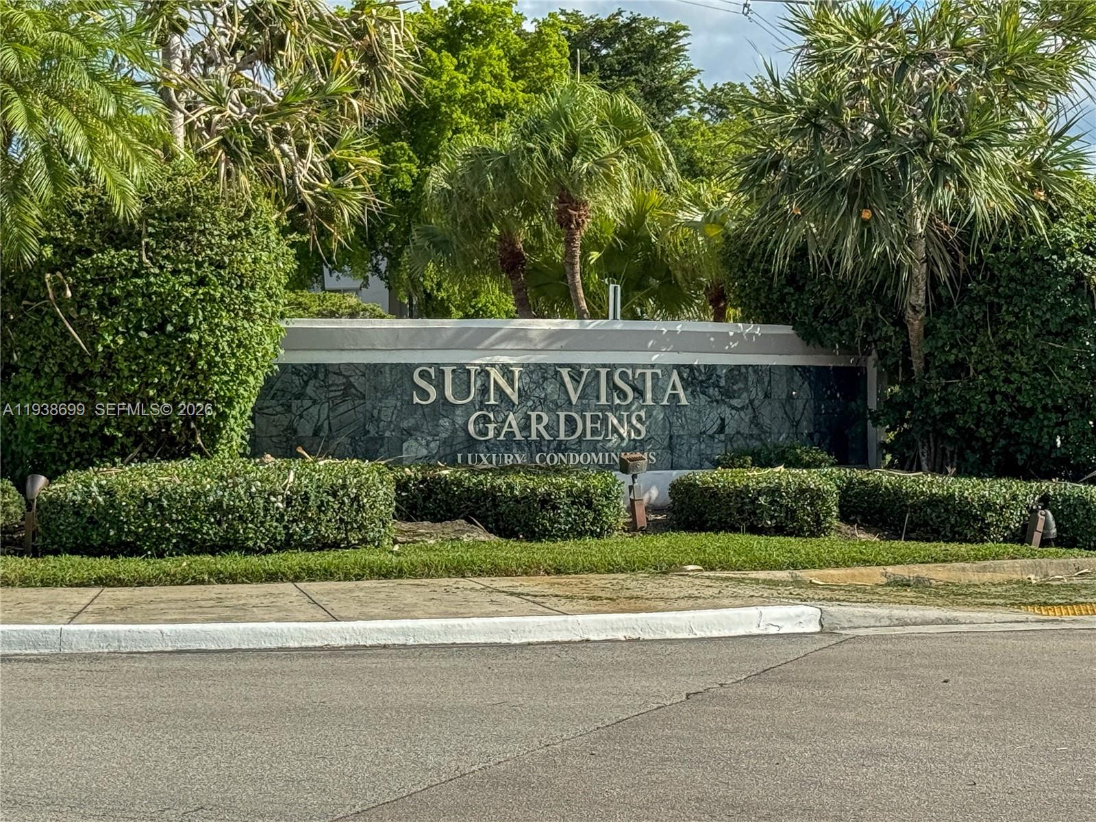 5672 Rock Island Road, Unit 271 Tamarac, FL 33319 - Photo 9 of 11 a view of a house with a yard and potted plants