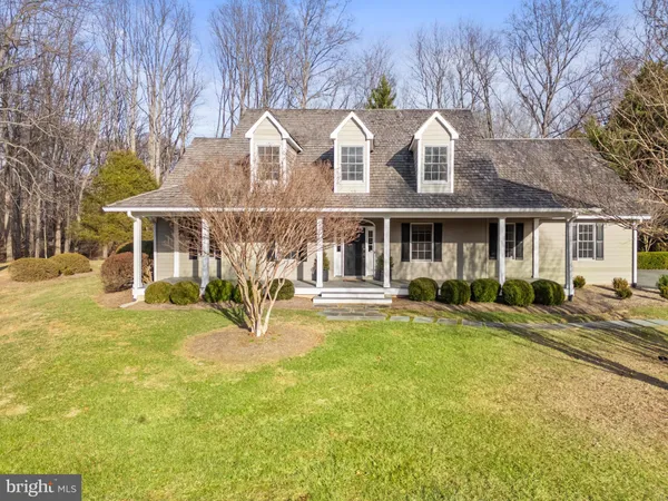 a view of a house with swimming pool and porch