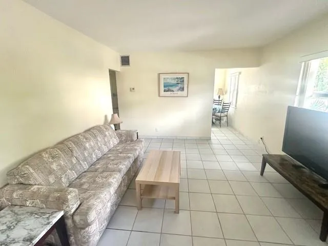 a spacious bathroom with a double vanity sink and a mirror