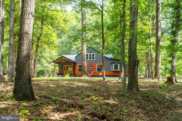 a house with trees in the background