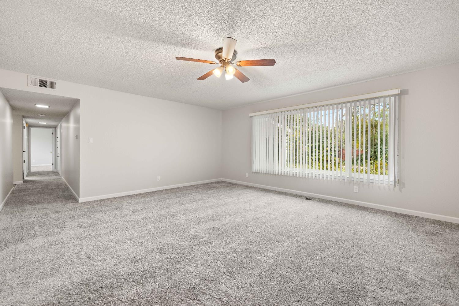 4907 Crestview Drive Carmichael, CA 95608 - Photo 17 of 33 a view of a livingroom with a ceiling fan and window