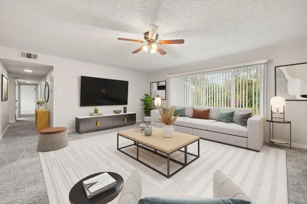 a living room with furniture and a flat screen tv
