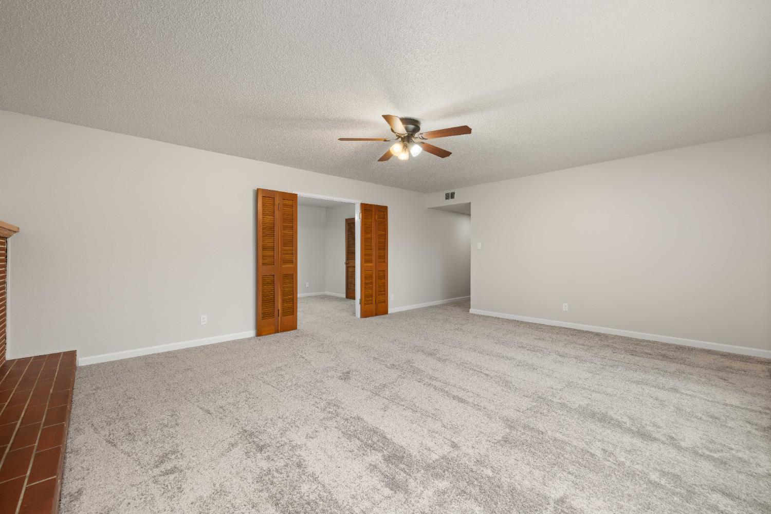 4907 Crestview Drive Carmichael, CA 95608 - Photo 22 of 33 a view of an empty room with a ceiling fan