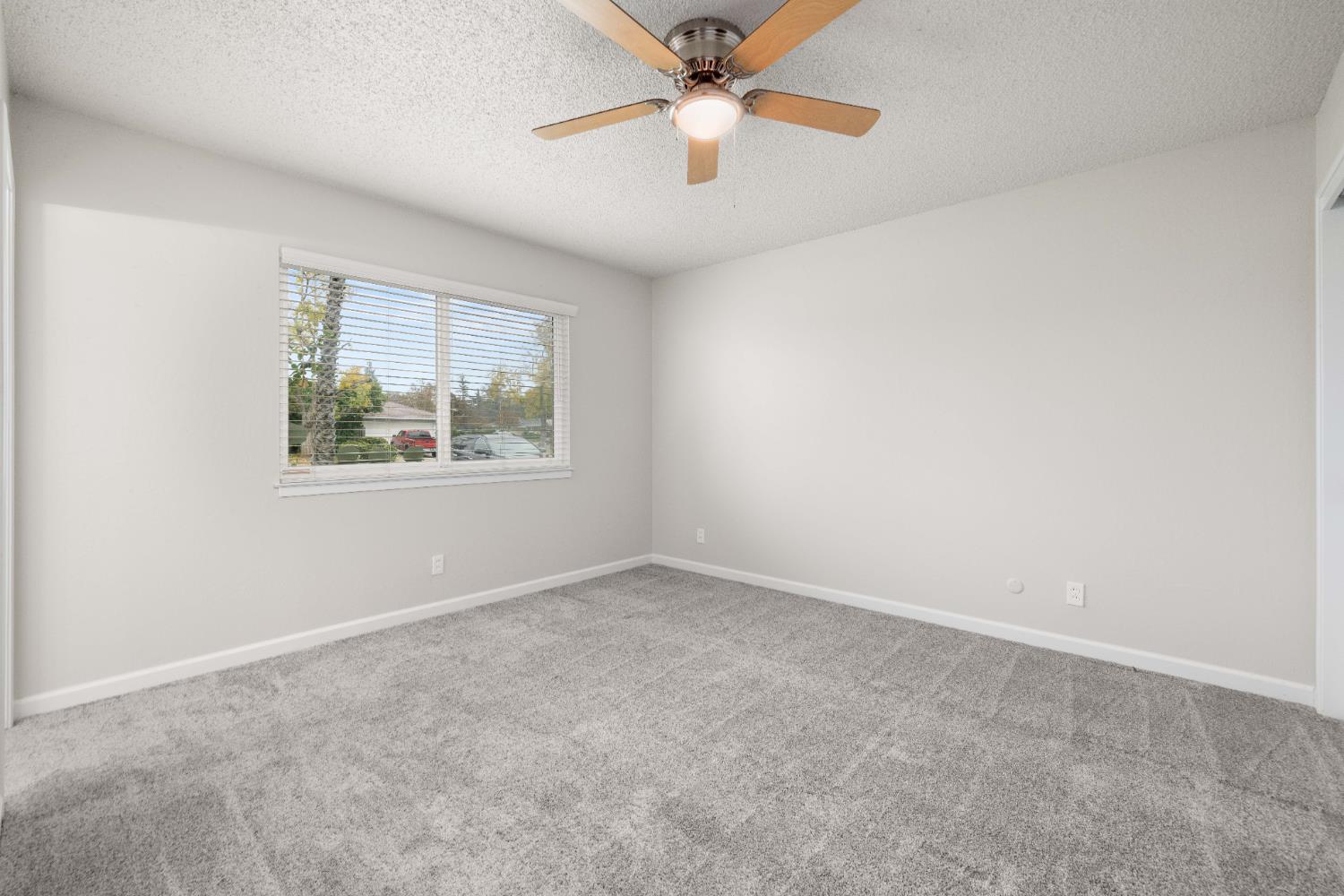 4907 Crestview Drive Carmichael, CA 95608 - Photo 27 of 33 an empty room with windows and fan