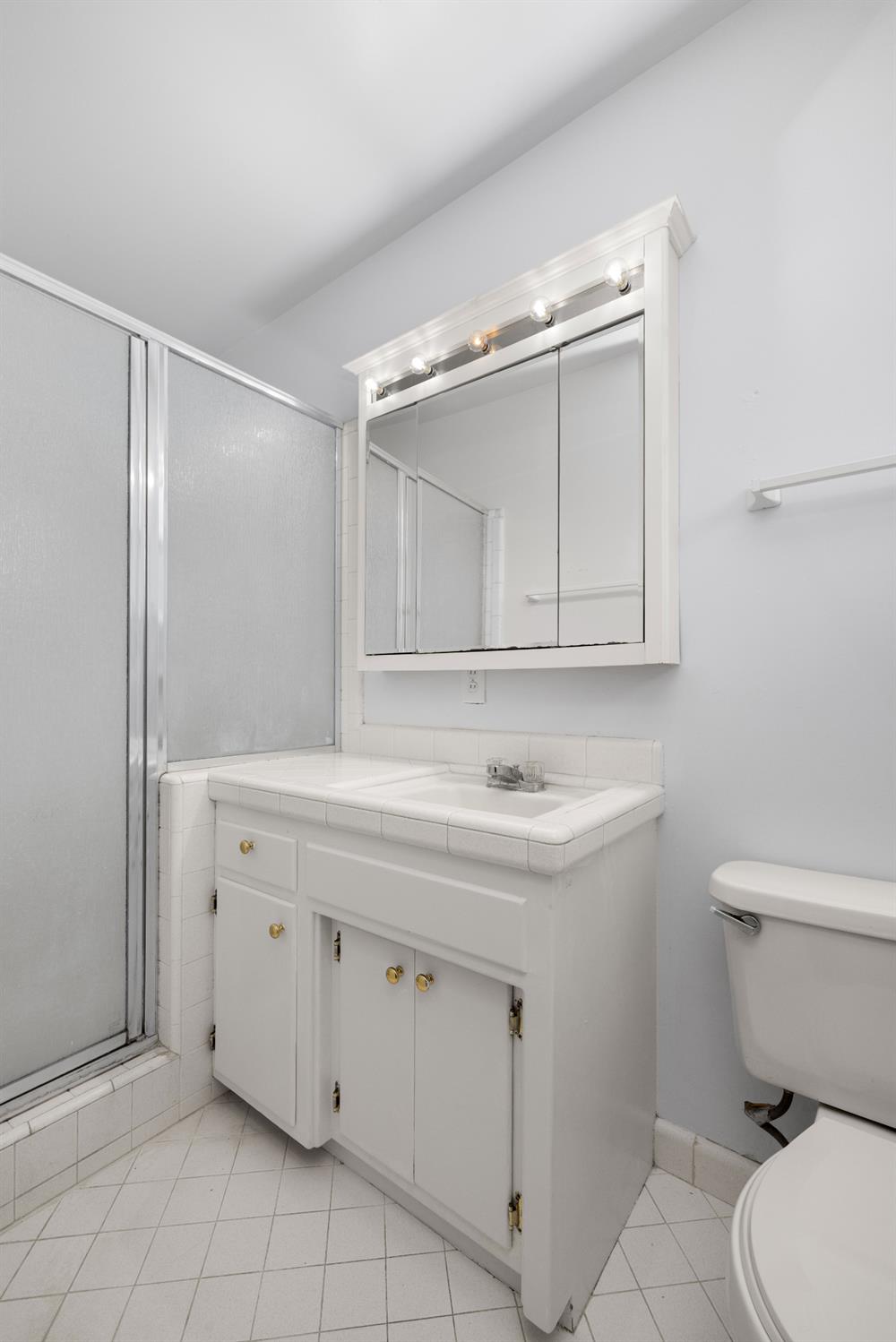 4907 Crestview Drive Carmichael, CA 95608 - Photo 30 of 33 a bathroom with a sink a toilet and mirror