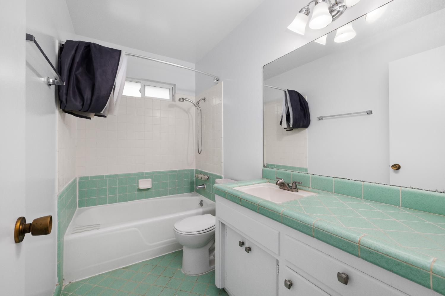 4907 Crestview Drive Carmichael, CA 95608 - Photo 31 of 33 a bathroom with a sink a mirror and a bathtub
