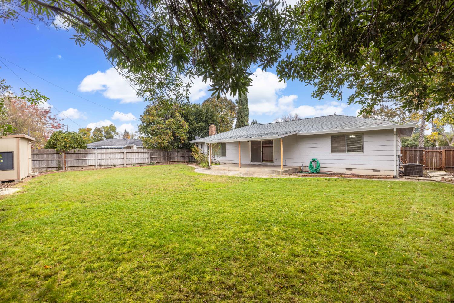4907 Crestview Drive Carmichael, CA 95608 - Photo 5 of 33 a front view of a house with yard and green space