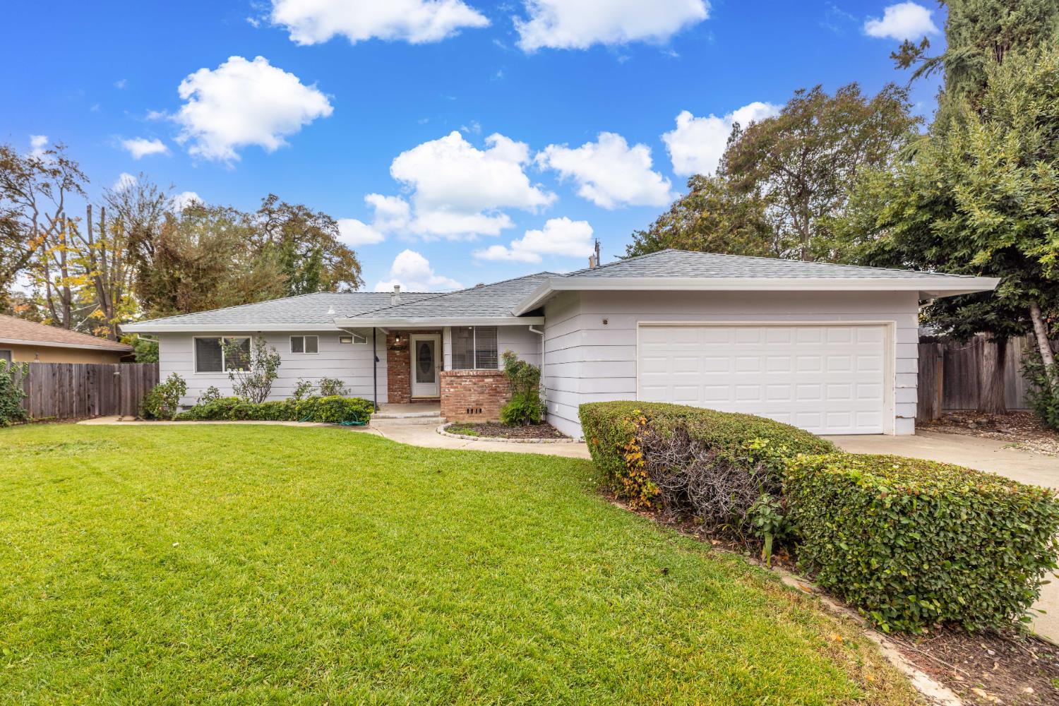4907 Crestview Drive Carmichael, CA 95608 - Photo 6 of 33 a front view of house with yard and trees in the background