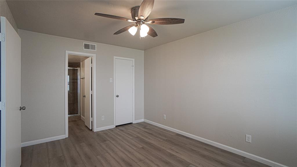 4606 Chaha Road, Unit 103 Garland, TX 75043 - Photo 12 of 23 wooden floor in an empty room