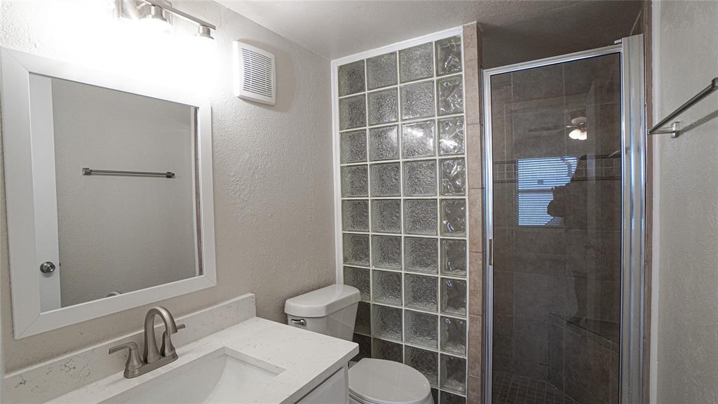 4606 Chaha Road, Unit 103 Garland, TX 75043 - Photo 14 of 23 a bathroom with a sink and a mirror