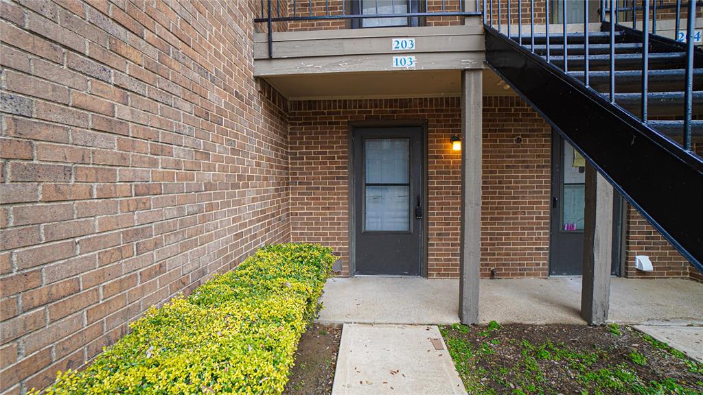 4606 Chaha Road, Unit 103 Garland, TX 75043 - Photo 2 of 23 a front view of a house with a garden