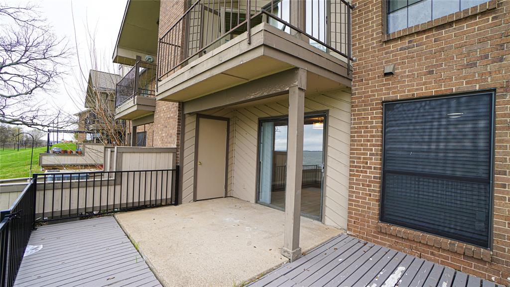 4606 Chaha Road, Unit 103 Garland, TX 75043 - Photo 22 of 23 a view of a brick house with a large window